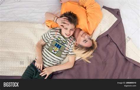 mom and son sharing the bed|Mom and Her 9.